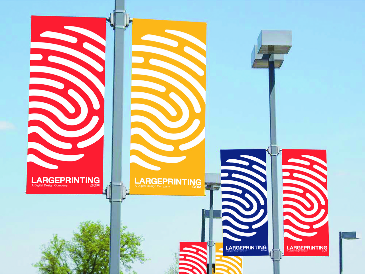 Banners hanging from poles with large white finger prints on red, yellow and blue